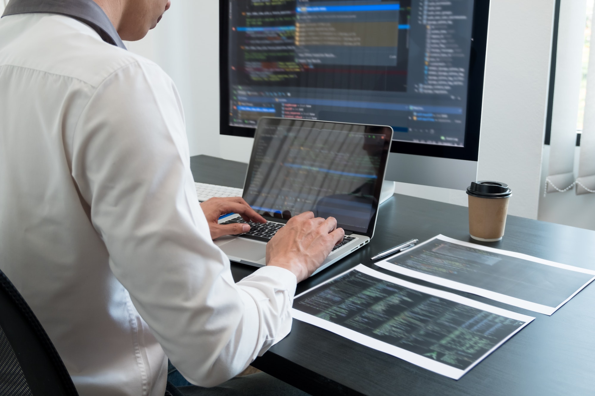 Programmer, Man working with computer programming, professional development, and coding technology